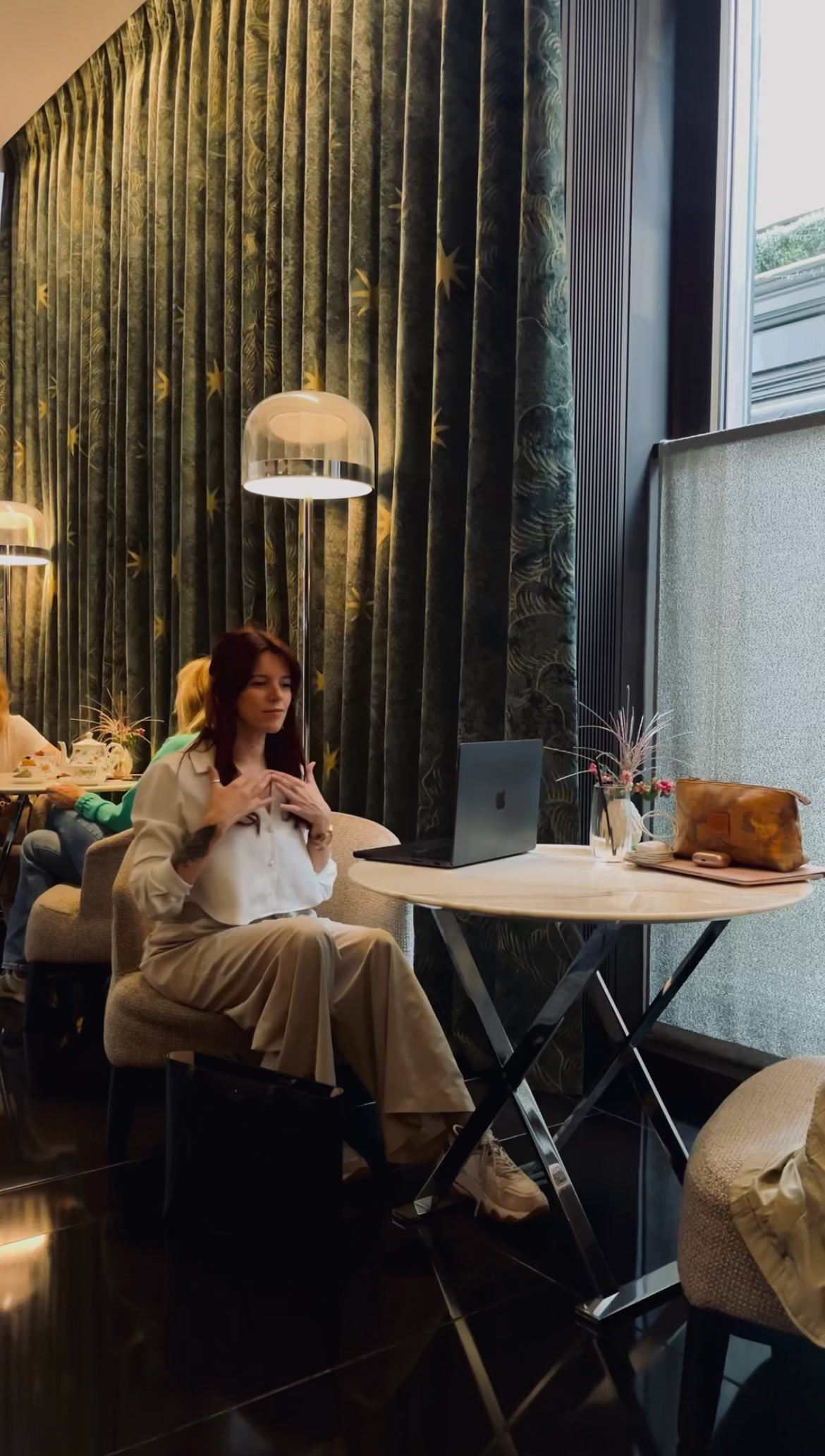 Mag at her laptop in a London café