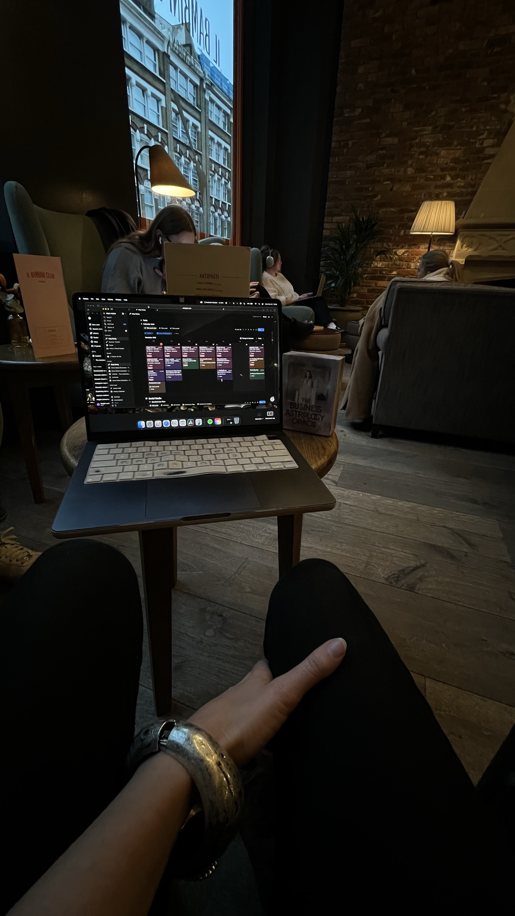 The Muse Planner open on Mag's laptop in a London café